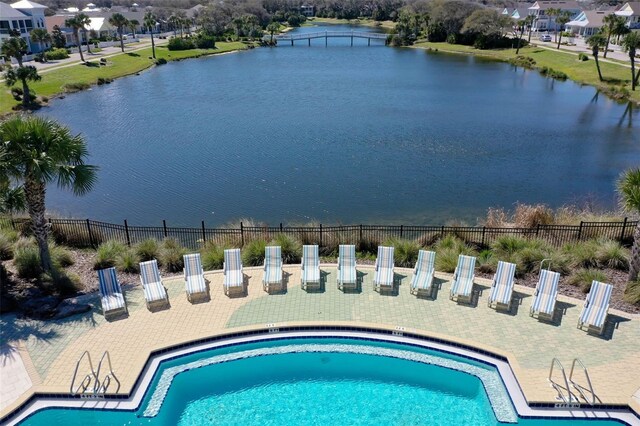 view of pool with a water view