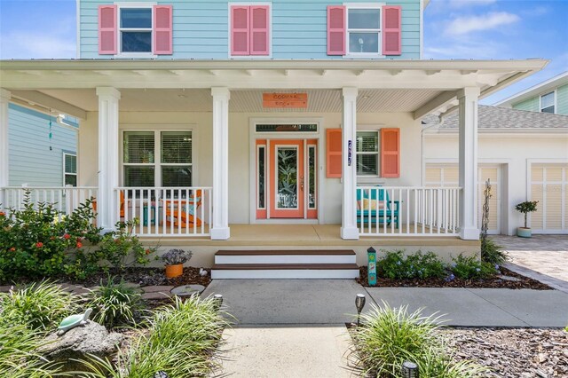 entrance to property featuring a porch