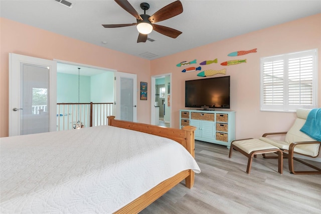 bedroom featuring light wood-type flooring and ceiling fan