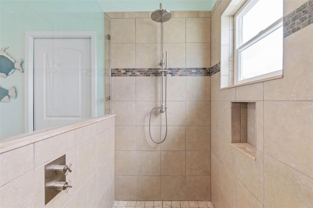 bathroom featuring tiled shower