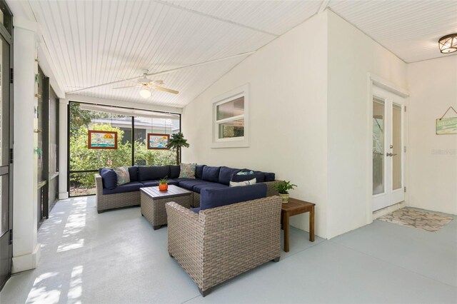 sunroom / solarium featuring ceiling fan