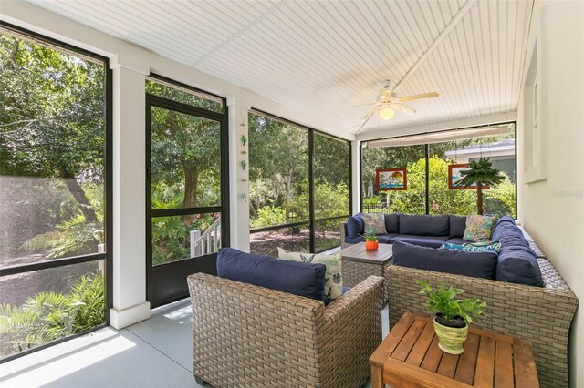 sunroom featuring ceiling fan