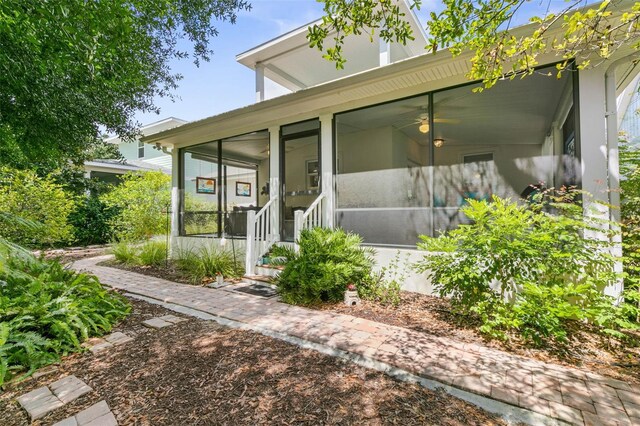 exterior space featuring a sunroom