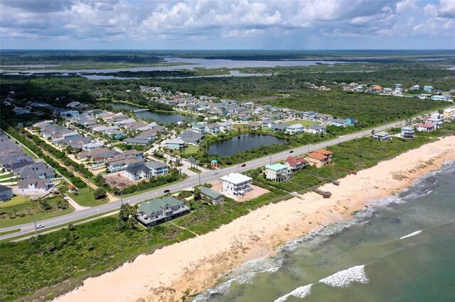 aerial view featuring a beach view and a water view