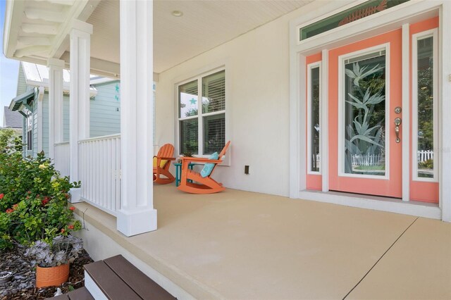 47 Sandy Bch, Way, Palm Coast, FL 32137 - doorway to property with a porch