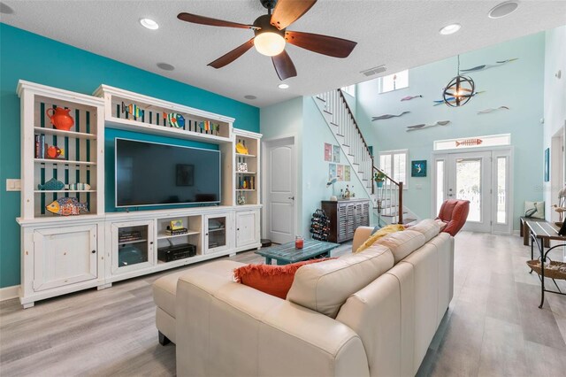 47 Sandy Bch, Way, Palm Coast, FL 32137 - living area featuring ceiling fan, wood finished floors, stairway, a textured ceiling, and recessed lighting