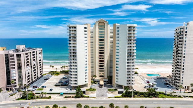 exterior space with a beach view and a water view