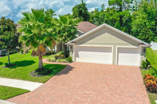 view of front of home with a garage and a front yard