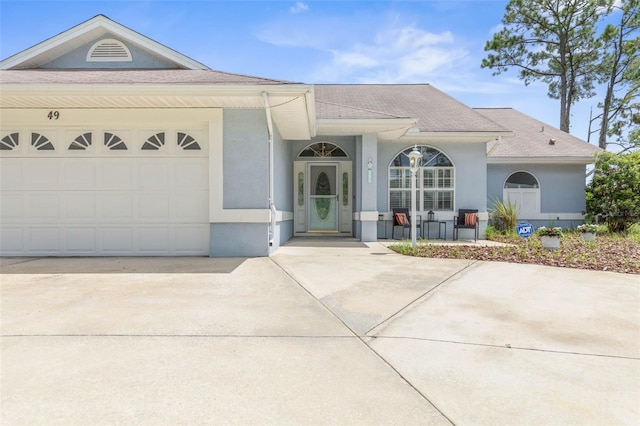 view of front of property featuring a garage