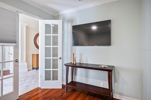 interior space featuring ornamental molding, french doors, and hardwood / wood-style flooring