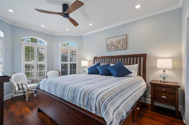 bedroom with crown molding, ceiling fan, and dark hardwood / wood-style floors