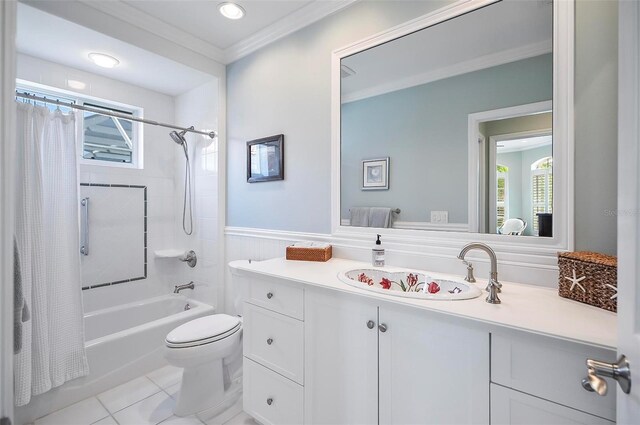 full bathroom with crown molding, tile patterned floors, toilet, shower / bath combo with shower curtain, and vanity