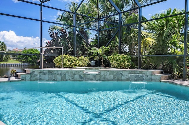 view of swimming pool with pool water feature and a lanai