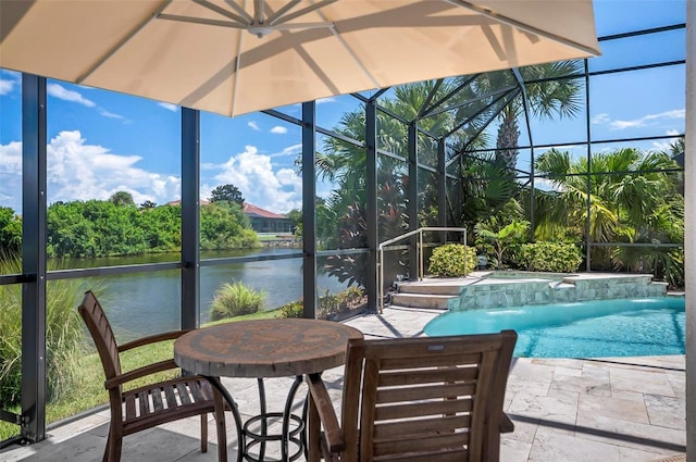 view of swimming pool with a lanai, a water view, a patio area, and pool water feature