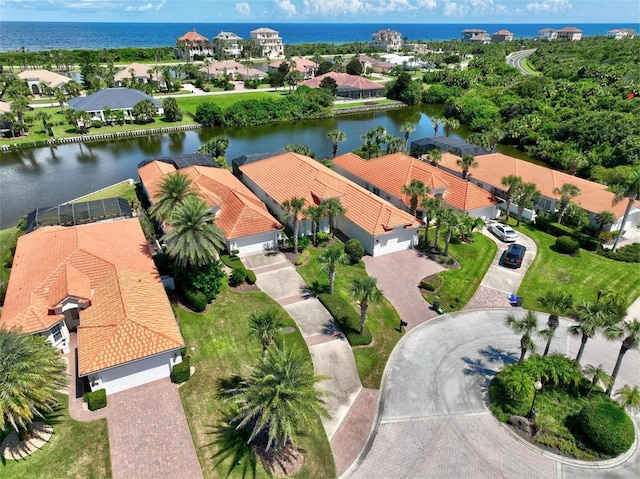 birds eye view of property with a water view