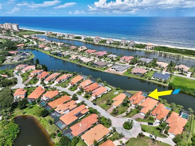 birds eye view of property featuring a water view