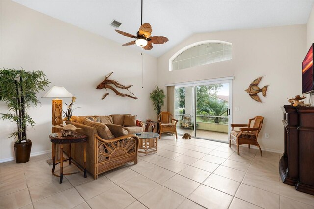 living room with high vaulted ceiling, light tile patterned floors, and ceiling fan