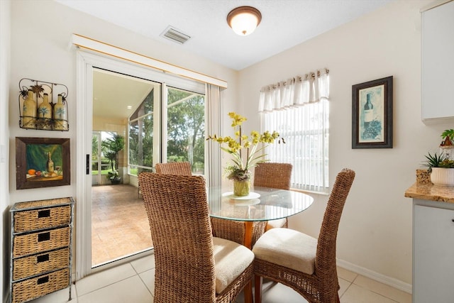 dining room featuring light tile patterned flooring