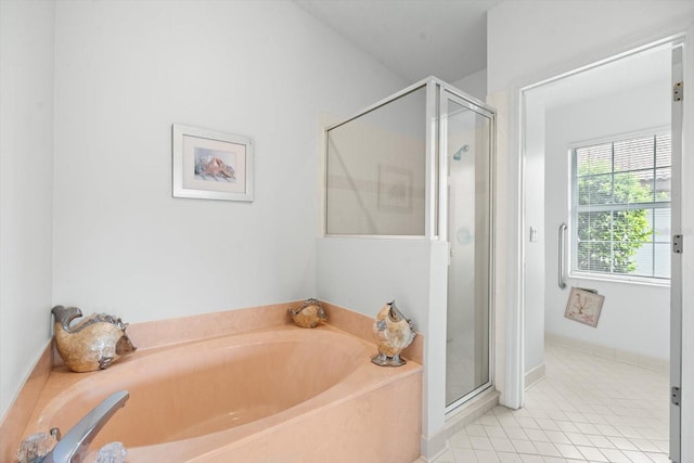 bathroom with separate shower and tub and tile patterned floors