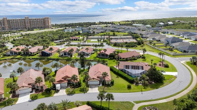 birds eye view of property featuring a water view