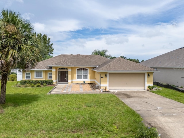 single story home featuring a front lawn and a garage