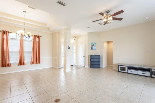 unfurnished living room with ceiling fan with notable chandelier, a raised ceiling, and light tile patterned flooring