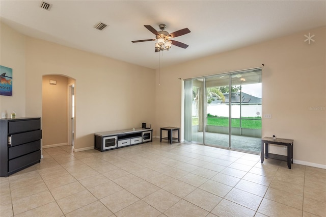 tiled living room featuring ceiling fan