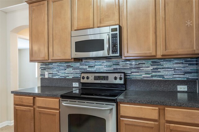 kitchen featuring backsplash and appliances with stainless steel finishes