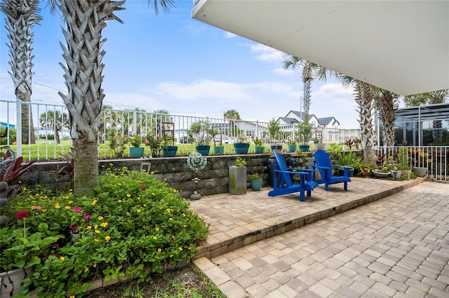 view of patio / terrace with a lanai