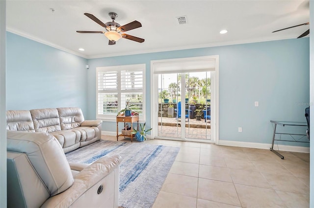 tiled living room with crown molding and ceiling fan