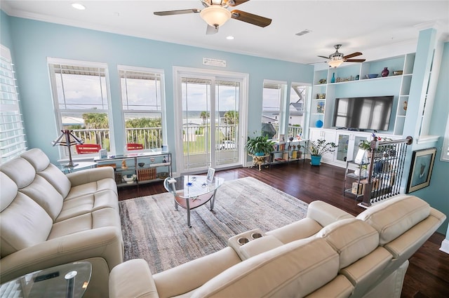 living room with ceiling fan, dark hardwood / wood-style floors, and crown molding