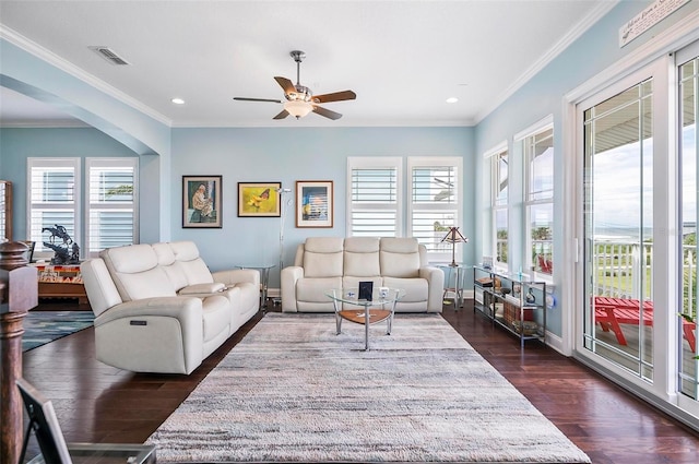 living room with ceiling fan, dark hardwood / wood-style floors, and ornamental molding