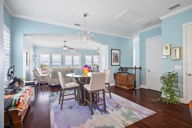 dining space featuring ceiling fan with notable chandelier, dark hardwood / wood-style flooring, and ornamental molding