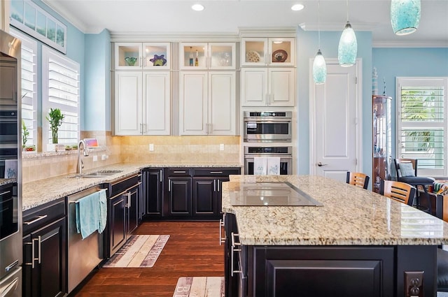 kitchen featuring white cabinetry, a kitchen island, and stainless steel appliances