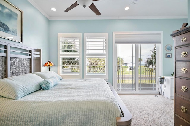 carpeted bedroom featuring ceiling fan, ornamental molding, multiple windows, and access to outside