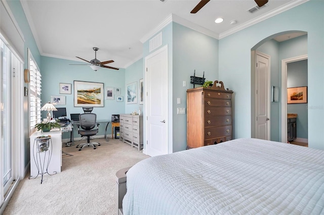 carpeted bedroom with ceiling fan and ornamental molding