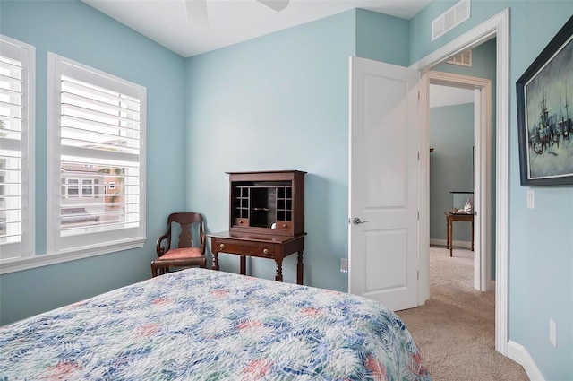 carpeted bedroom featuring ceiling fan