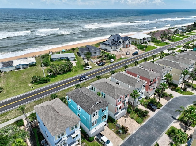 drone / aerial view with a view of the beach and a water view