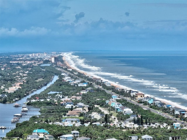 aerial view featuring a water view and a beach view