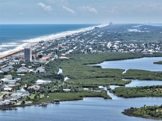 drone / aerial view featuring a view of the beach and a water view