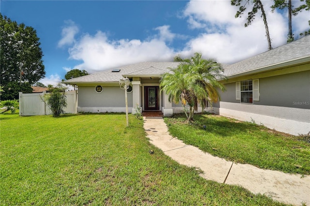 view of front of property with a front lawn