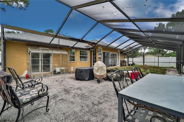 view of patio / terrace featuring a lanai