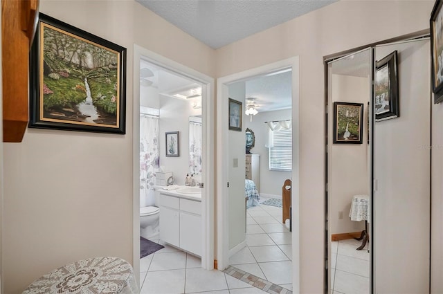 8 Sea Vista Dr, Palm Coast, FL 32137 - full bath with vanity, toilet, a textured ceiling, tile patterned floors, and ceiling fan