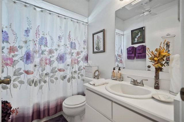 bathroom with vanity, toilet, and a shower with shower curtain