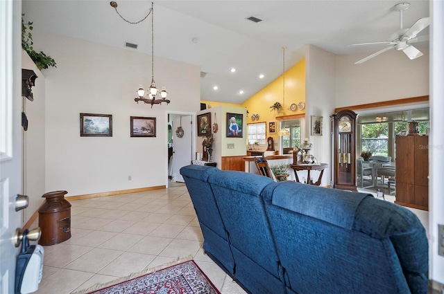 8 Sea Vista Dr, Palm Coast, FL 32137 - living room with ceiling fan with notable chandelier, visible vents, high vaulted ceiling, and light tile patterned floors