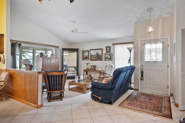 living room with ceiling fan, light tile patterned flooring, and a healthy amount of sunlight