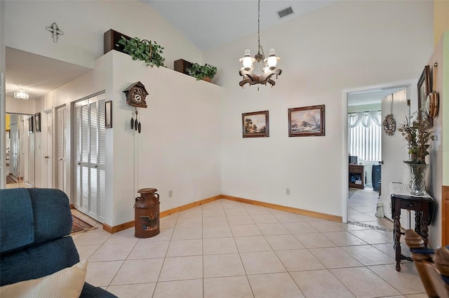 8 Sea Vista Dr, Palm Coast, FL 32137 - interior space featuring high vaulted ceiling, a notable chandelier, visible vents, and light tile patterned floors