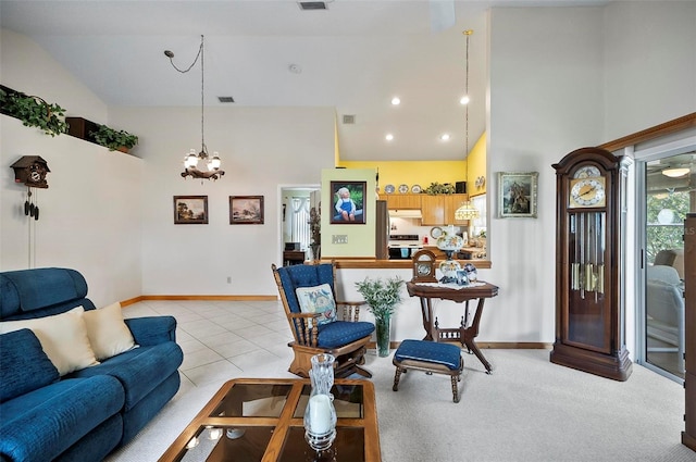 living room featuring high vaulted ceiling and light colored carpet