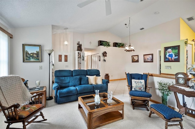 living room featuring lofted ceiling, light colored carpet, ceiling fan with notable chandelier, and a textured ceiling