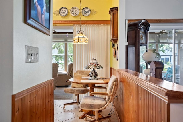 tiled dining room with plenty of natural light